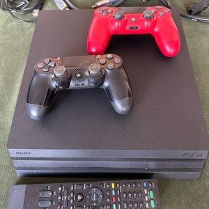 Sony PS 4 Pro with Controllers, Cables, and Remote